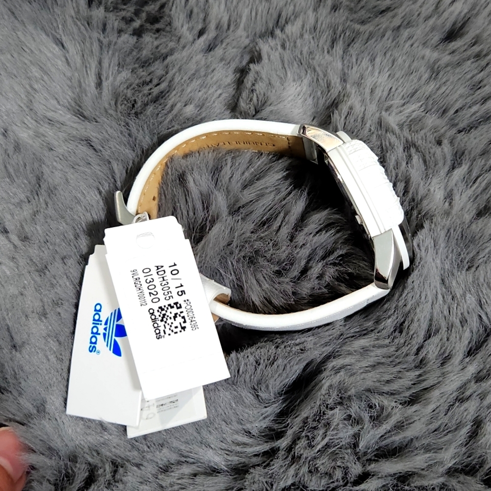 White addidas watch.